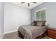 Bedroom with neutral walls, cozy bed, and natural light from the large window at 20563 W Edgemont Ave, Buckeye, AZ 85396