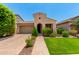 Charming single-story home featuring low maintenance landscaping, a two-car garage, and stylish curb appeal at 20563 W Edgemont Ave, Buckeye, AZ 85396