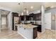 Modern kitchen with stainless steel appliances, a spacious island, and plenty of cabinet space at 20563 W Edgemont Ave, Buckeye, AZ 85396