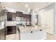 Well-equipped kitchen with granite countertops, stainless steel appliances, and ample cabinet space at 20563 W Edgemont Ave, Buckeye, AZ 85396