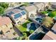 Beautiful aerial view of a home featuring a private backyard oasis, including a pool, lawn, and solar panels at 20722 N 38Th St, Phoenix, AZ 85050