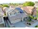 Aerial view of home featuring solar panels, mature landscaping, a concrete driveway, and a welcoming front porch at 20722 N 38Th St, Phoenix, AZ 85050