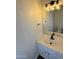 Bathroom featuring a white sink vanity, stylish lighting fixture, and sleek mirror for a modern touch at 20722 N 38Th St, Phoenix, AZ 85050