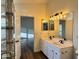 Elegant bathroom featuring double sinks, modern lighting, and updated fixtures with a bright, open space at 20722 N 38Th St, Phoenix, AZ 85050