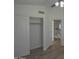 Bedroom features closet with wood-look floors and access to upper level at 20722 N 38Th St, Phoenix, AZ 85050