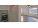 Bright, airy bedroom showcasing new flooring and a ceiling fan with a sunlit view of the outdoors at 20722 N 38Th St, Phoenix, AZ 85050