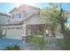 Charming two-story home featuring a spacious garage, stone accents, and a welcoming front porch at 20722 N 38Th St, Phoenix, AZ 85050