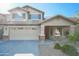 Charming two-story home featuring a spacious garage, stone accents, and a welcoming front porch at 20722 N 38Th St, Phoenix, AZ 85050
