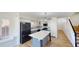 Well-appointed kitchen with white cabinetry, modern appliances, and a center island at 20722 N 38Th St, Phoenix, AZ 85050