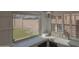 Cozy kitchen nook area with a window seat, shutters, backyard views, and decorative 