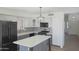 Updated kitchen featuring stainless steel appliances, white cabinets, and island at 20722 N 38Th St, Phoenix, AZ 85050