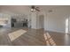 Open-concept living area with wood-look flooring, seamlessly connecting the living room and the renovated kitchen at 20722 N 38Th St, Phoenix, AZ 85050