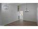 Bright living room featuring wood-look floors, modern light fixtures, and staircase at 20722 N 38Th St, Phoenix, AZ 85050