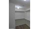 Spacious walk-in closet with shelving, rods, and modern lighting perfect for storage at 20722 N 38Th St, Phoenix, AZ 85050