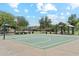 Outdoor basketball court featuring a covered picnic area surrounded by beautiful landscaping at 2313 E Hidalgo Ave, Phoenix, AZ 85040