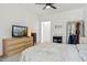Spacious bedroom with a large window, dresser, and walk-in closet, offering ample storage at 2313 E Hidalgo Ave, Phoenix, AZ 85040