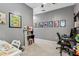 Neutral-toned bedroom with decoratively framed prints, carpet, and a ceiling fan at 2313 E Hidalgo Ave, Phoenix, AZ 85040