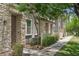 Charming townhome with stone accents, a well-maintained lawn, and a sidewalk in a desirable community at 2313 E Hidalgo Ave, Phoenix, AZ 85040