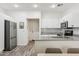 Modern kitchen with stainless steel appliances, granite countertops, and ample cabinet space at 2313 E Hidalgo Ave, Phoenix, AZ 85040