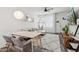 Cozy living and dining space with a hammock chair and modern decor at 2313 E Hidalgo Ave, Phoenix, AZ 85040