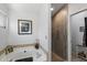 Bright bathroom featuring a tiled shower, a soaking tub, and stylish decor at 2488 Leisure World --, Mesa, AZ 85206
