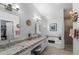 Bathroom features a soaking tub, dual vanities and a glass-enclosed shower at 2488 Leisure World --, Mesa, AZ 85206