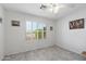 Bright bedroom with tile floor, ceiling fan and large windows at 2488 Leisure World --, Mesa, AZ 85206