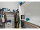 Walk-in closet providing plenty of storage with shelves and rods for organized living at 2488 Leisure World --, Mesa, AZ 85206