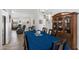 Inviting dining area with a blue tablecloth, adjacent to the living room and a china cabinet at 2488 Leisure World --, Mesa, AZ 85206