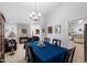 Cozy dining room with a fireplace, chandelier, and an open layout at 2488 Leisure World --, Mesa, AZ 85206