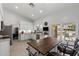 Open concept kitchen with a prep island, tile floors, and sliding door access to a patio at 2488 Leisure World --, Mesa, AZ 85206