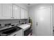 Well-equipped laundry room with updated washer and dryer and abundant storage space at 2488 Leisure World --, Mesa, AZ 85206