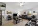 Comfortable living room with tile floors, a ceiling fan, and an abundance of natural light at 2488 Leisure World --, Mesa, AZ 85206