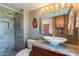 This bathroom features a stylish vessel sink, sleek vanity, updated tiling, and an enclosed shower at 2524 S El Paradiso -- # 17, Mesa, AZ 85202