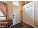 Inviting foyer with hardwood floors, coat closet, and stylish decor for a warm welcome at 2524 S El Paradiso -- # 17, Mesa, AZ 85202