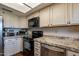 Modern kitchen featuring stainless steel appliances and ample cabinet space at 2524 S El Paradiso -- # 17, Mesa, AZ 85202
