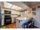 Cozy kitchen with white cabinets and a breakfast bar, perfect for casual dining at 2524 S El Paradiso -- # 17, Mesa, AZ 85202