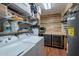 Well-organized laundry room with washer, dryer, shelving, and wine coolers for added convenience at 2524 S El Paradiso -- # 17, Mesa, AZ 85202