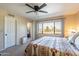 Comfortable main bedroom featuring a large window offering beautiful views of the community golf course at 2524 S El Paradiso -- # 17, Mesa, AZ 85202