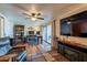 Living room boasts a partial office, a TV, fireplace, bookshelves and lots of room to entertain at 2524 S El Paradiso -- # 17, Mesa, AZ 85202