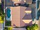 Birds eye view of a pool with a freeform shape, small grassy area, and privacy fence at 3220 W Frankfurt Dr, Chandler, AZ 85226