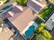 Aerial view of backyard with a freeform pool, small grassy area, and plenty of trees at 3220 W Frankfurt Dr, Chandler, AZ 85226