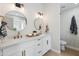 Modern bathroom with dual sinks, white cabinets, and gold fixtures at 3220 W Frankfurt Dr, Chandler, AZ 85226