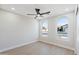Spacious bedroom with ceiling fan and bright windows at 3220 W Frankfurt Dr, Chandler, AZ 85226