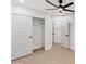 Bright bedroom with modern closet and ceiling fan at 3220 W Frankfurt Dr, Chandler, AZ 85226