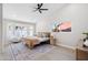 Bright bedroom featuring a ceiling fan, large windows and a stylish rug at 3220 W Frankfurt Dr, Chandler, AZ 85226