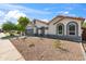 Attractive single-story home boasts stylish architectural details, well-maintained landscaping, and a welcoming front yard at 3220 W Frankfurt Dr, Chandler, AZ 85226