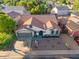 Aerial shot of a charming single-story home boasting a well-manicured yard and inviting curb appeal at 3220 W Frankfurt Dr, Chandler, AZ 85226