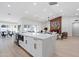 Spacious kitchen with island, quartz countertops, stainless steel appliances, and an open layout at 3220 W Frankfurt Dr, Chandler, AZ 85226