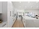Updated kitchen featuring stainless steel appliances, white cabinetry, and spacious quartz counter tops at 3220 W Frankfurt Dr, Chandler, AZ 85226